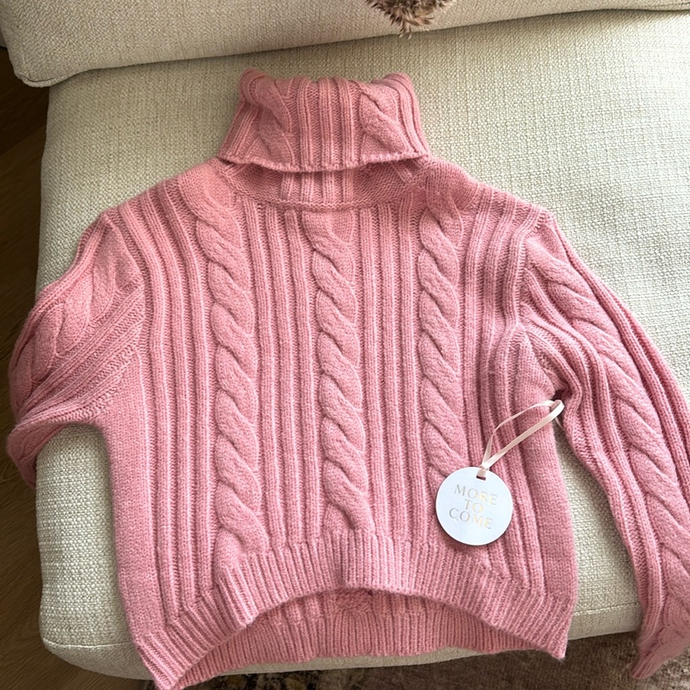 MORE TO COME pink turtleneck